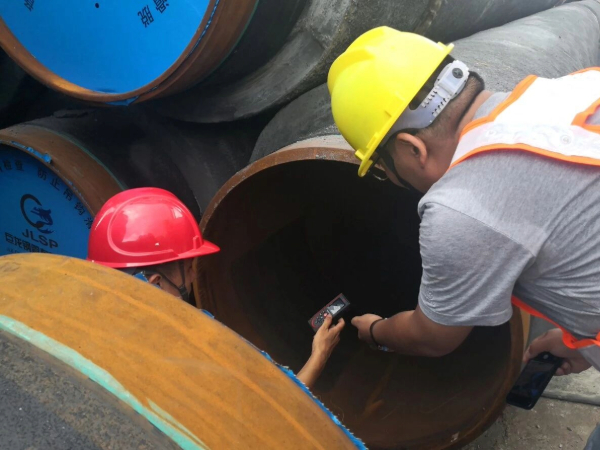 Concrete weight coated pipe being loaded for offshore pipeline project