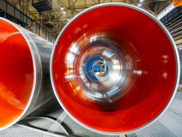 FBE coated pipe surface close-up showing smooth epoxy finish