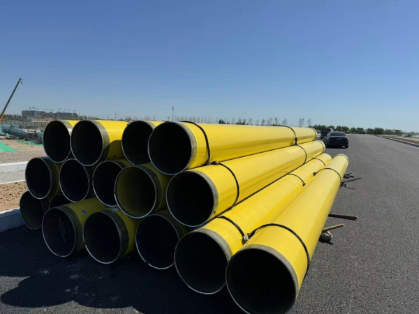 Dual layer FBE coating on carbon steel pipe for high temperature service