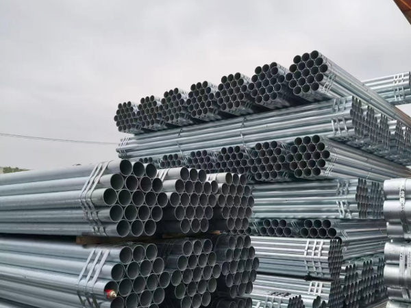 Galvanized pipe end view showing zinc coating thickness and weld seam