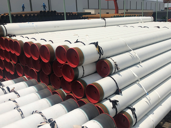 PE coated pipe cut-end showing epoxy primer and PE layers