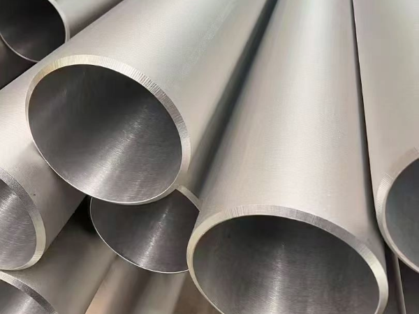 Stainless steel seamless pipe section cut showing wall thickness